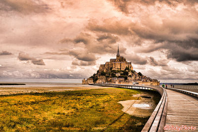 Scenic view of sea against cloudy sky