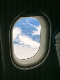 Cloudy sky seen through window