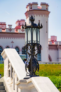 Beautiful openwork metal lantern on a sunny day.