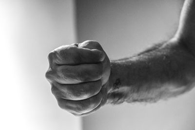 Close-up of human hand clenched into fist