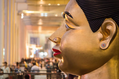 Close-up of golden statue in temple