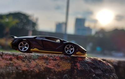 Close-up of toy car on retaining wall