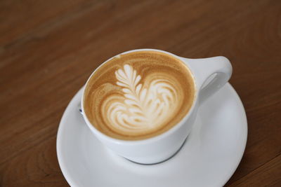 High angle view of cappuccino on table