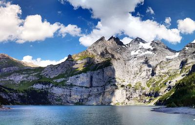 Scenic view of mountains and sea against sky