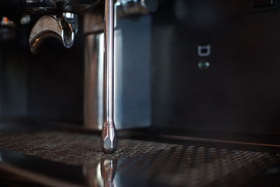 Close-up of water falling on table at home