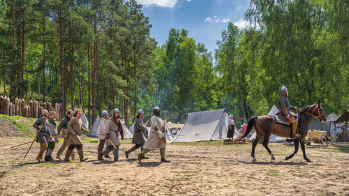 Group of people against trees