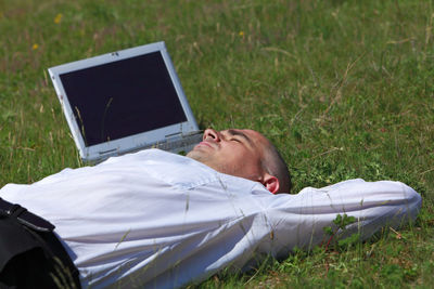 Man lying down on field