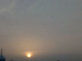 Low angle view of moon against sky during sunset