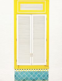 Close-up of yellow shutter window