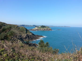 High angle view of sea against clear blue sky