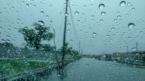 Raindrops on glass window during rainy season