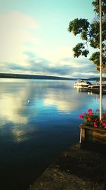 Scenic view of lake against cloudy sky