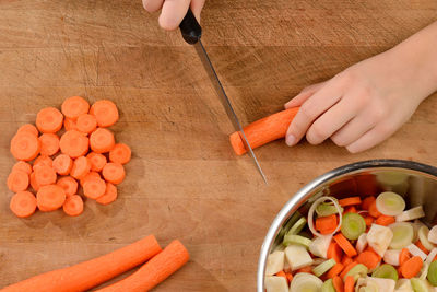 High angle view of man preparing food on cutting board