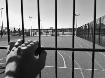 Close-up of human hand against the sky