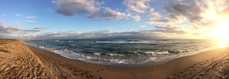 Scenic view of beach against sky