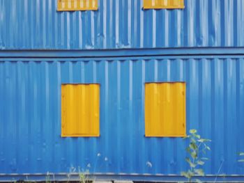 Close-up of yellow closed door of building