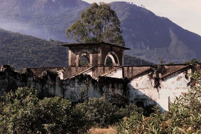 View of built structure against mountain range