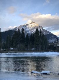 Scenic view of snowcapped mountains by lake against sky cascade mountain