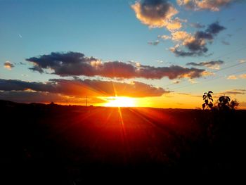 Scenic view of silhouette landscape against sky during sunset