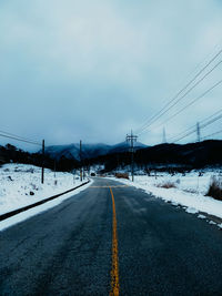 Road against sky during winter