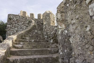 Low angle view of old ruin against sky