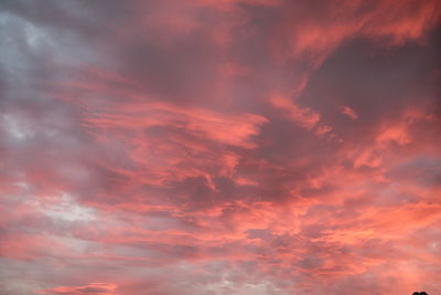 Low angle view of dramatic sky during sunset