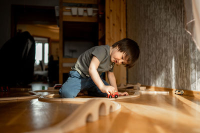 Side view of man working at table