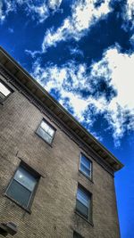 Low angle view of building against blue sky