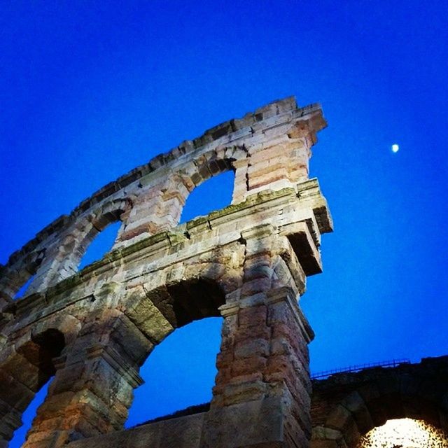 architecture, built structure, low angle view, history, blue, clear sky, old ruin, arch, ancient, the past, old, famous place, ancient civilization, travel destinations, international landmark, tourism, travel, building exterior, ruined, abandoned