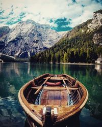 Boat in river with mountain in background