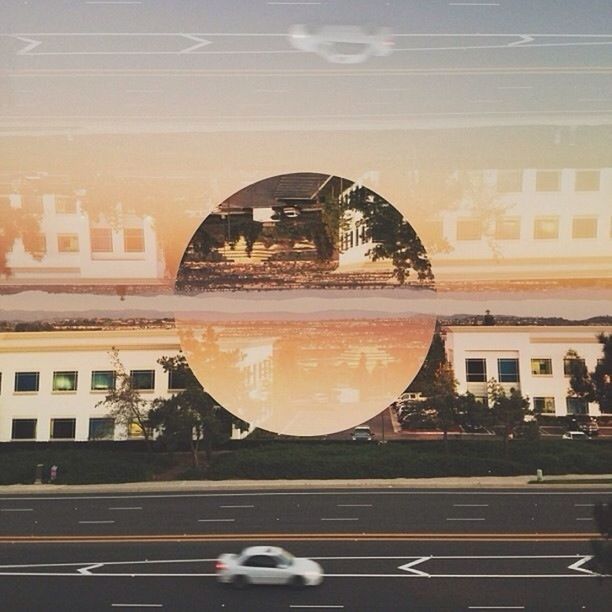 DIGITAL COMPOSITE IMAGE OF STREET AND BUILDINGS AGAINST SKY