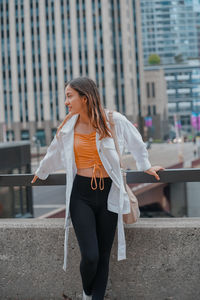 Side view of woman standing on street