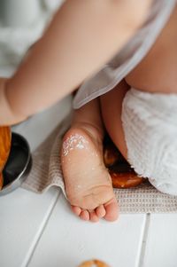 Low section of woman washing hands