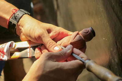 Close-up of man holding hands