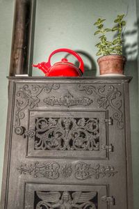 Close-up of red carving on wall