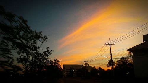 Low angle view of silhouette trees against sky during sunset