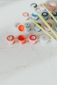 High angle view of figurines on white background