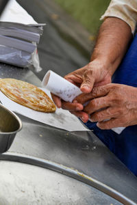 High angle view of man preparing food