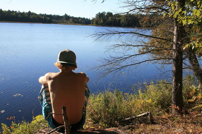 Calm lake with trees in background