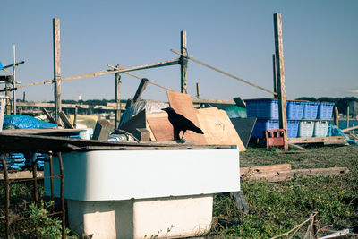 Abandoned boats on beach against clear sky