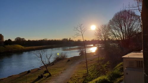 Scenic view of lake against sky during sunset