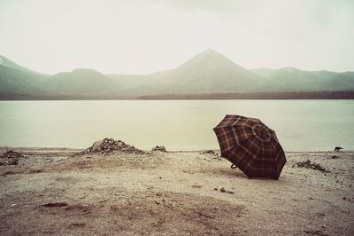 Scenic view of umbrella by the lake