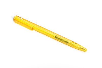 High angle view of yellow pencils on white background