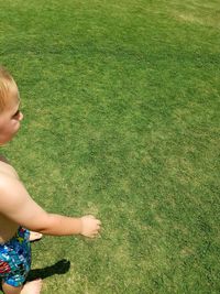 Woman standing on grassy field