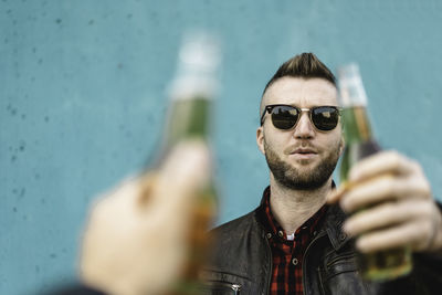 Portrait of young man wearing sunglasses