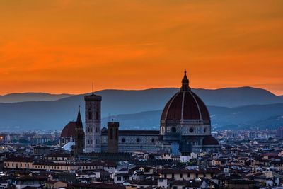 High angle view of buildings against sky during sunset