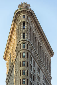 Low angle view of flatiron building against sky