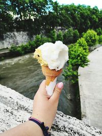 Midsection of person holding ice cream cone