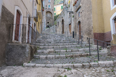 Narrow alley amidst buildings in town