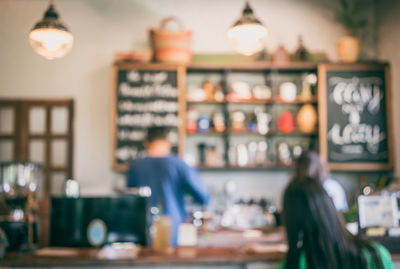 Rear view of people working in restaurant